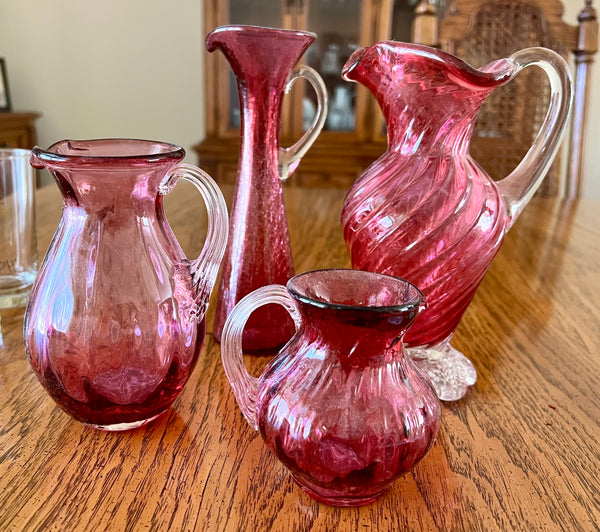 Pilgrim Glass Set of 4 Cranberry Glass Pitchers of Varying Heights