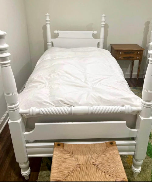 Pair of White Antique Twin Spindle Beds with Bedding Shown